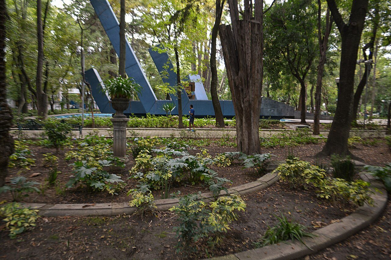 Garden beds and trees in Parque España, Condesa