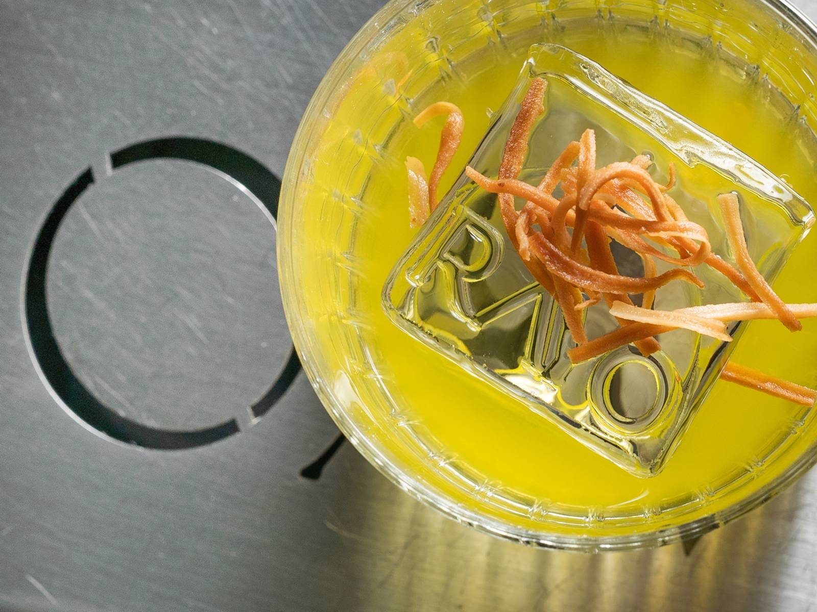 A cocktail with a Rayo-branded ice cube